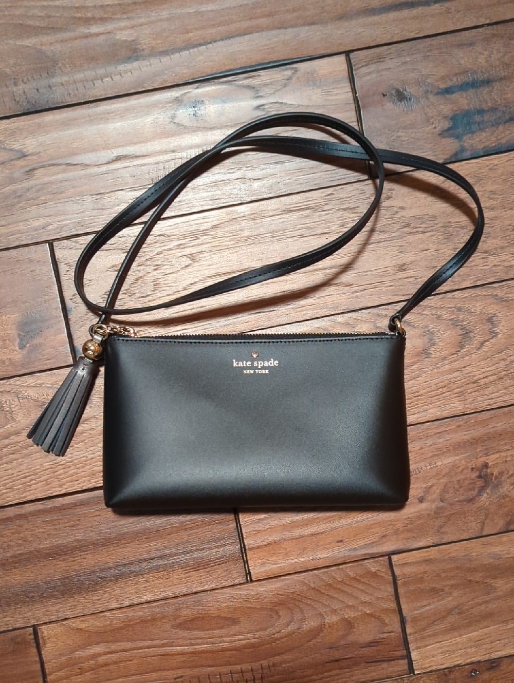 kate spade black crossbody with tassel